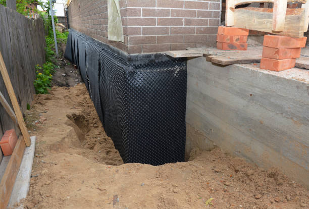 SJ Waterproofing Pros technician performing targeted Waterproofing assessment in Pleasantville, NY